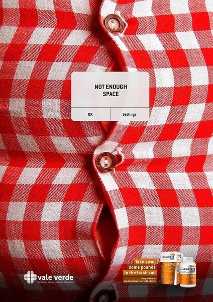 A diet supplement ad using a digital UI error message on a tight buttoned shirt to visually represent bloating and the need for weight loss.